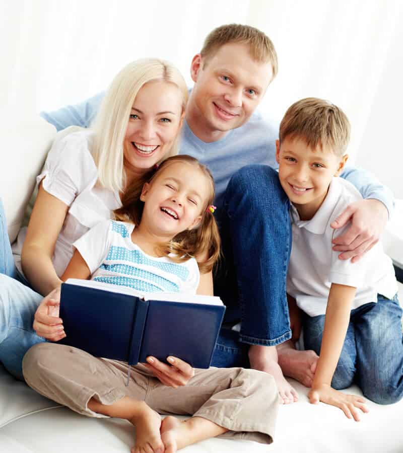 Family smiling and satisfied with AFB mortgage services, celebrating their successful loan approval.